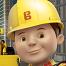 A close up of a friendly construction working wearing a yellow hat.